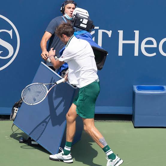 Russia's Daniil Medvedev was caught furiously kicking a camera after accidentally colliding with it - THE SPORTS ROOM